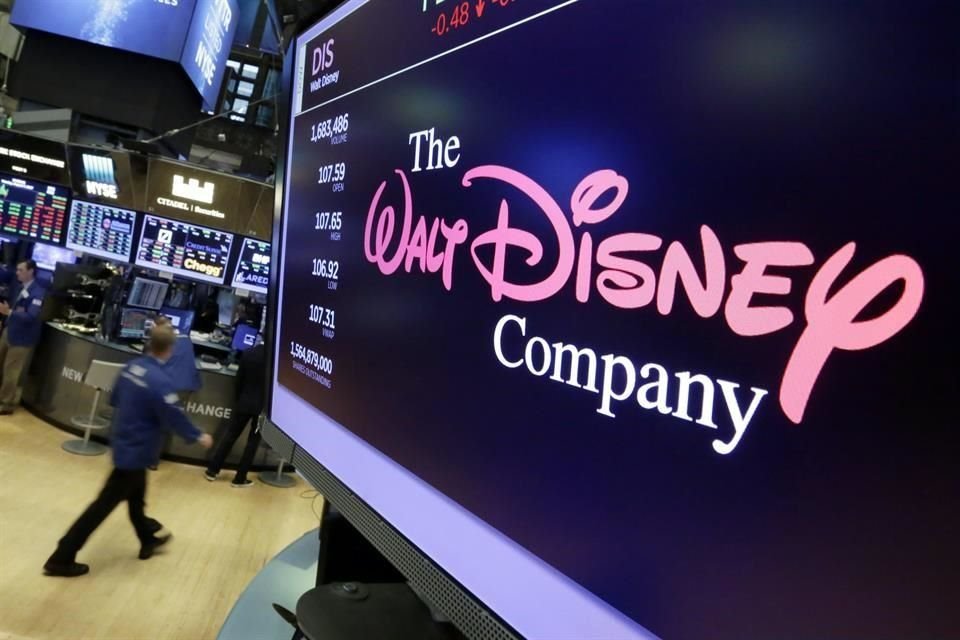 In this Monday, Aug. 7, 2017, photo, The Walt Disney Co. logo appears on a screen above the floor of the New York Stock Exchange. The Walt Disney Co. reports ea