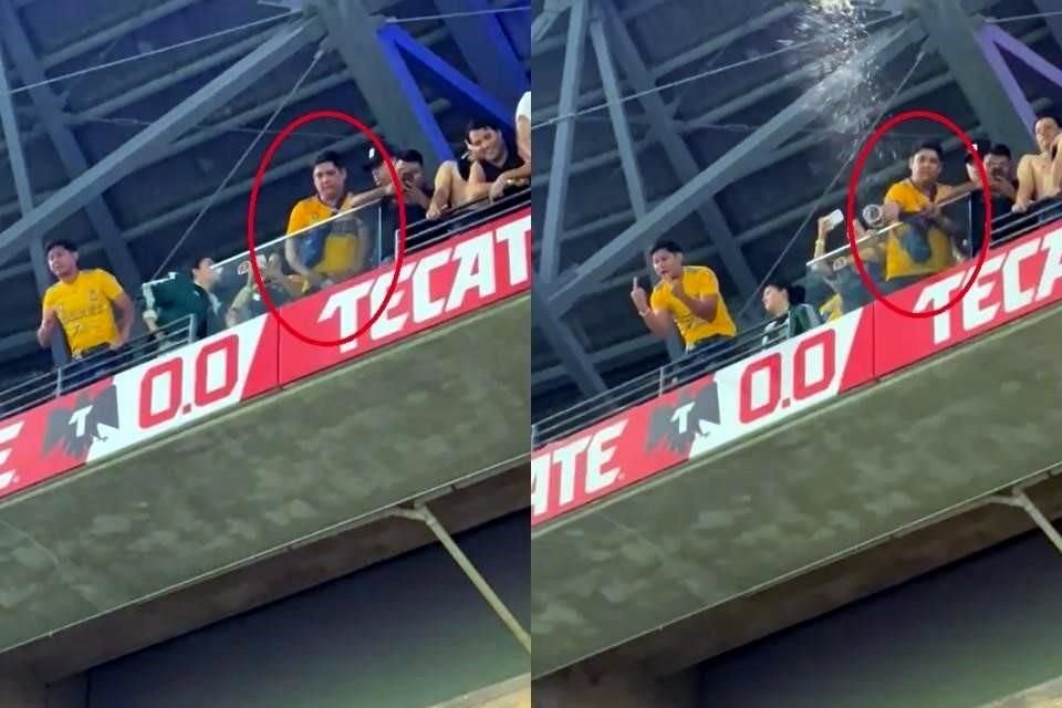 El aficionado (círculo) primero tiene un vaso en sus manos a la altura de la cintura y después lanza un líquido.
