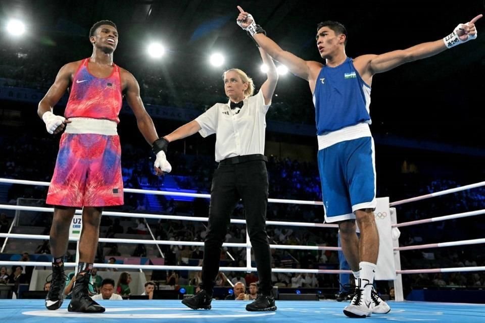 Muydinkhujaev (azul) también anhela el oro olímpico.