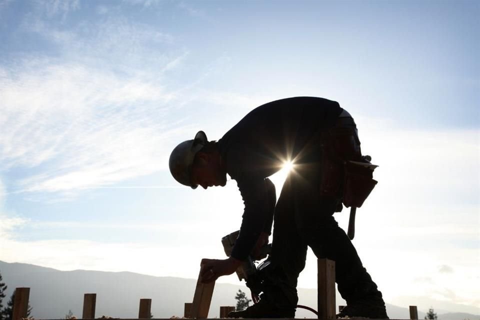 The proposal to reduce the work week to 40 hours within five years is reasonable, but it would have to be done gradually, experts say.