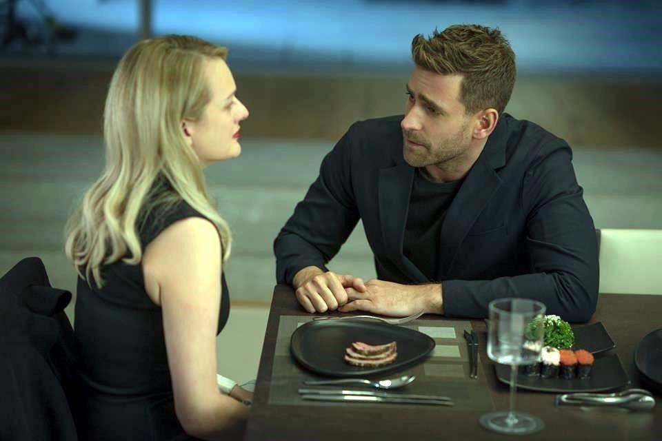 This image released by Universal Pictures shows Elisabeth Moss, left, and Oliver Jackson-Cohen in a scene from 'The Invisible Man.' (Mark Rogers/Universal Pictures via AP)