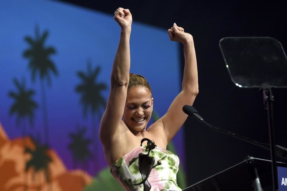Jennifer Lopez reacts as she accepts the spotlight actress award for her role in 'Hustlers' at the 31st annual Palm Springs , 2020, in Palm Springs, Calif. (AP Photo/Chris Pizzello)